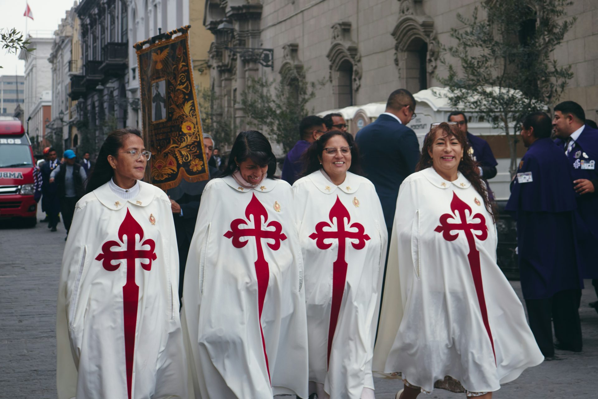 A group of people walking down a street