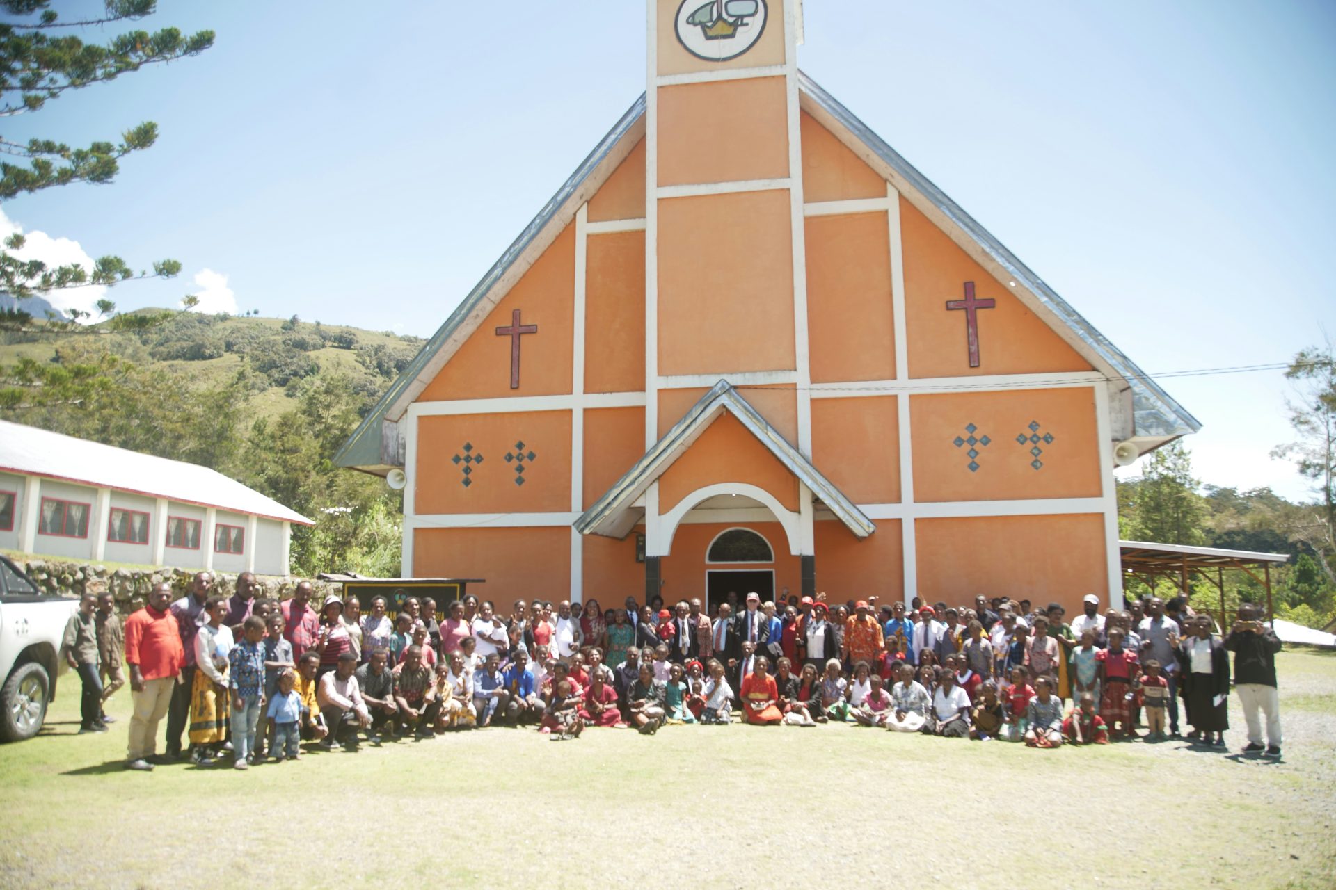 a group of people standing in front of a church